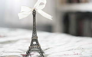 Eiffel Tower party favor on white textile